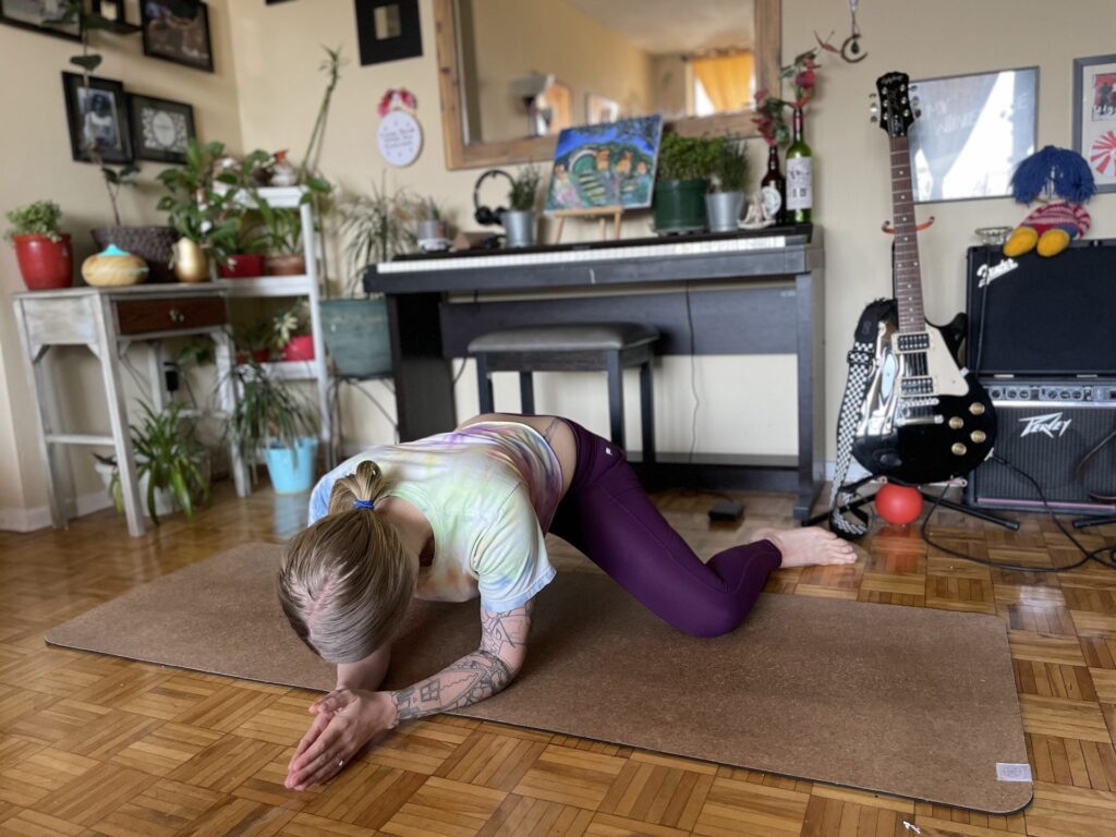 girl doing frog pose during yoga
