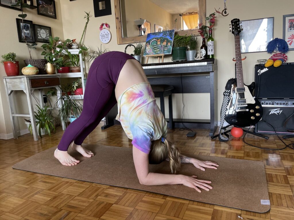 Girl doing dolphin pose in yoga